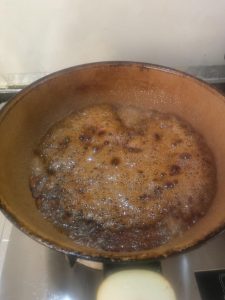 Soy sauce and rice wine added to the caramel