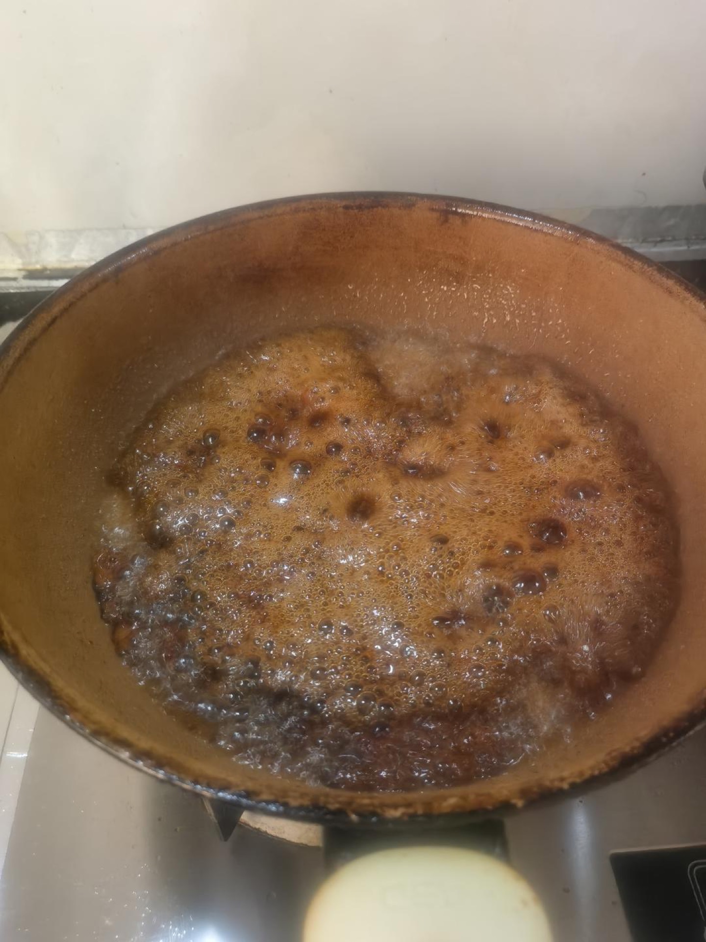 Soy sauce and rice wine added to the caramel