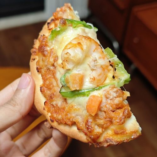 Four-inch homemade mini pizzas with melted mozzarella cheese