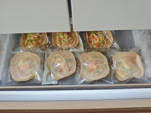 Frozen mini pizzas being finished in the air fryer