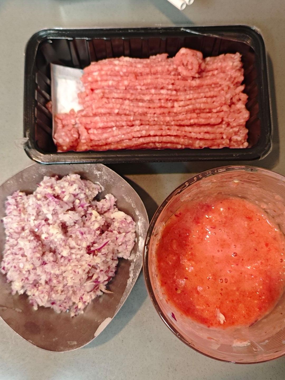 Minced onion, garlic, and blended tomatoes ready for the pizza sauce