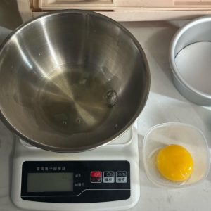 Egg separated into yolk and white in two clean bowls