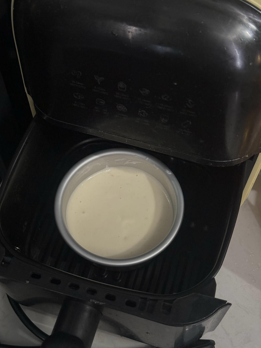 Sponge cake baking in the air fryer under foil