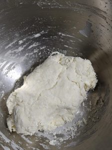 Kneading the dough into a ball for its first rest