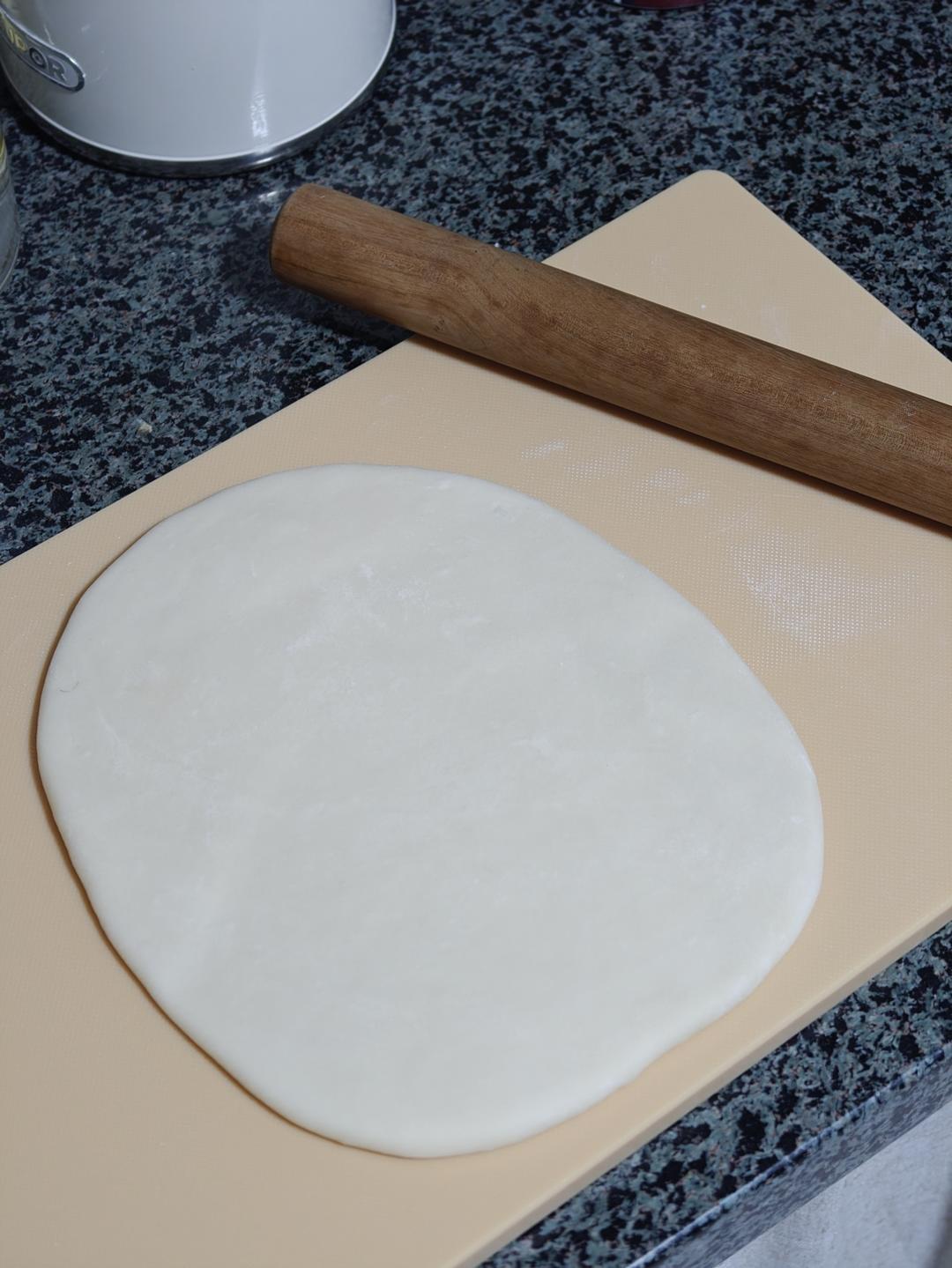 Rolling the dough into a thin sheet