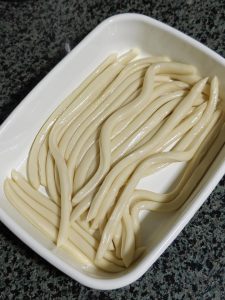 Brushing the cut strips with oil and covering them to rest