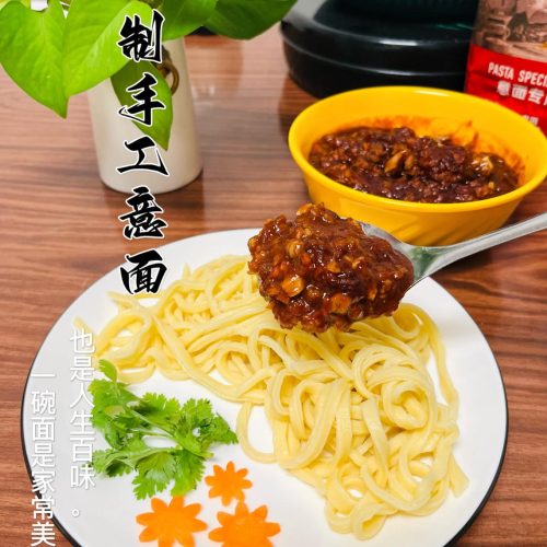 Handmade pasta with tomato meat sauce in a bowl, fresh egg noodles coated in rich red sauce