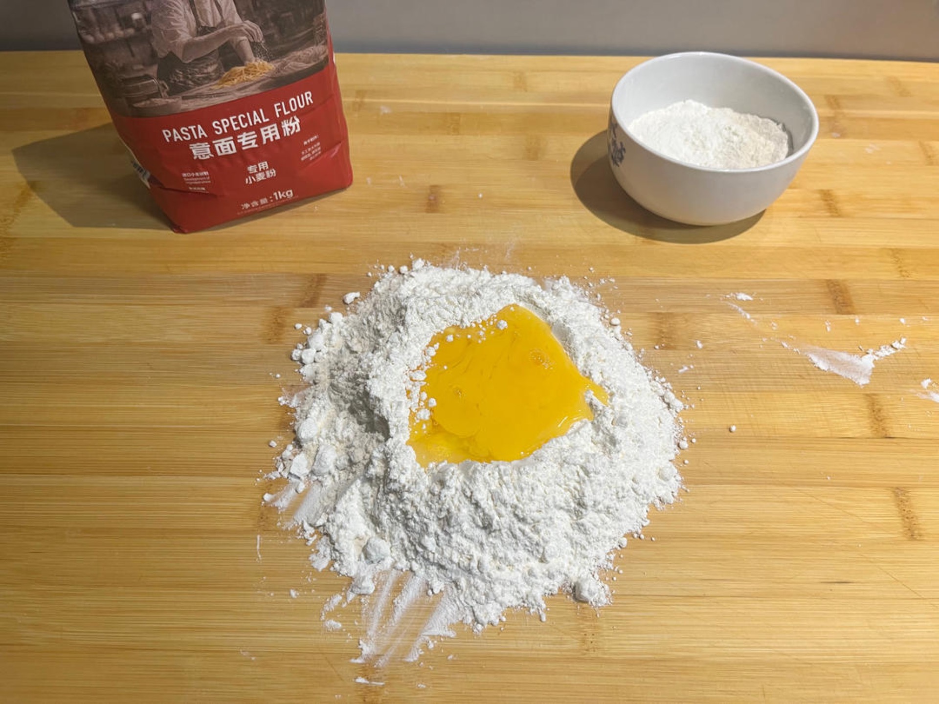 Mix the Italian-style pasta flour with the salt until evenly combined, then crack in the eggs.