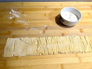 Cut the sheet into pasta noodles.