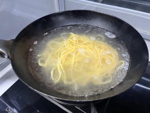 Once the water boils, add the noodles.