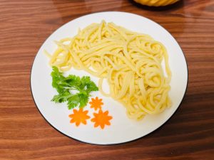 Transfer the noodles to a plate.