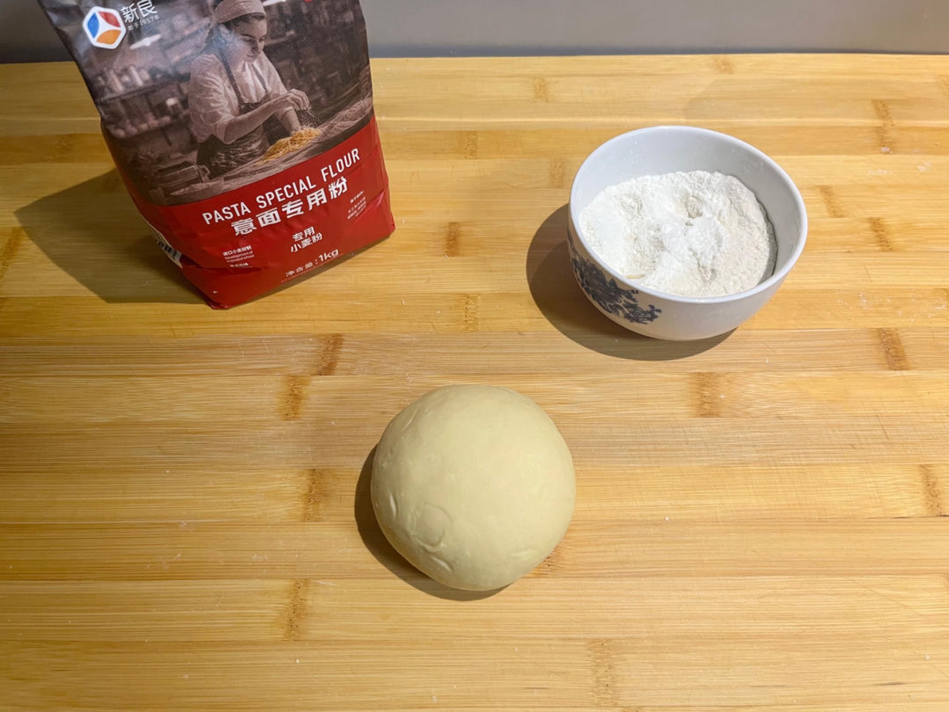 Knead into a firm, slightly stiff dough, then rest it sealed for 30 minutes; knead again until smooth and rest it sealed for another 2 hours — always cover it well so the surface d