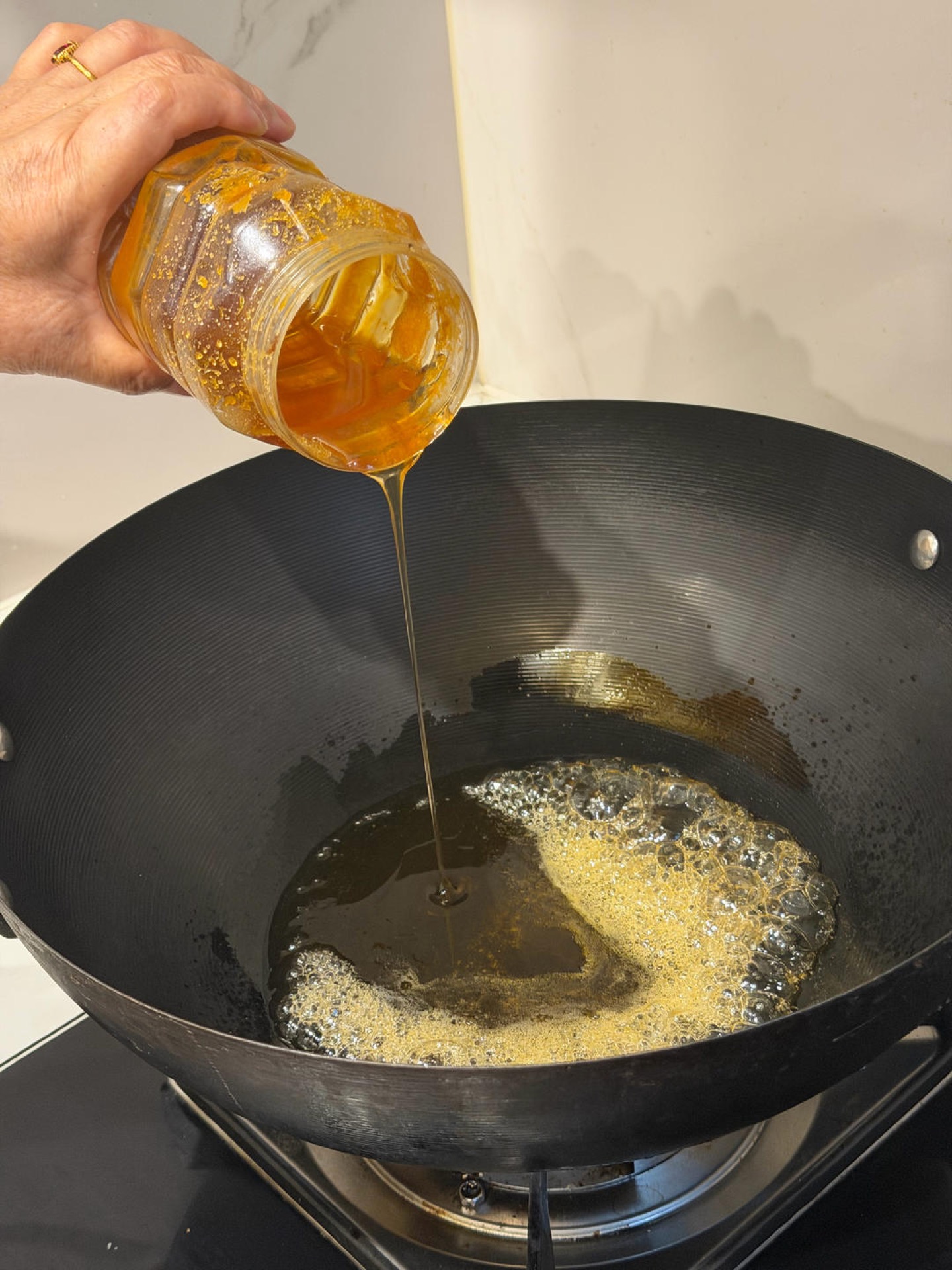 Honey bubbling in a skillet