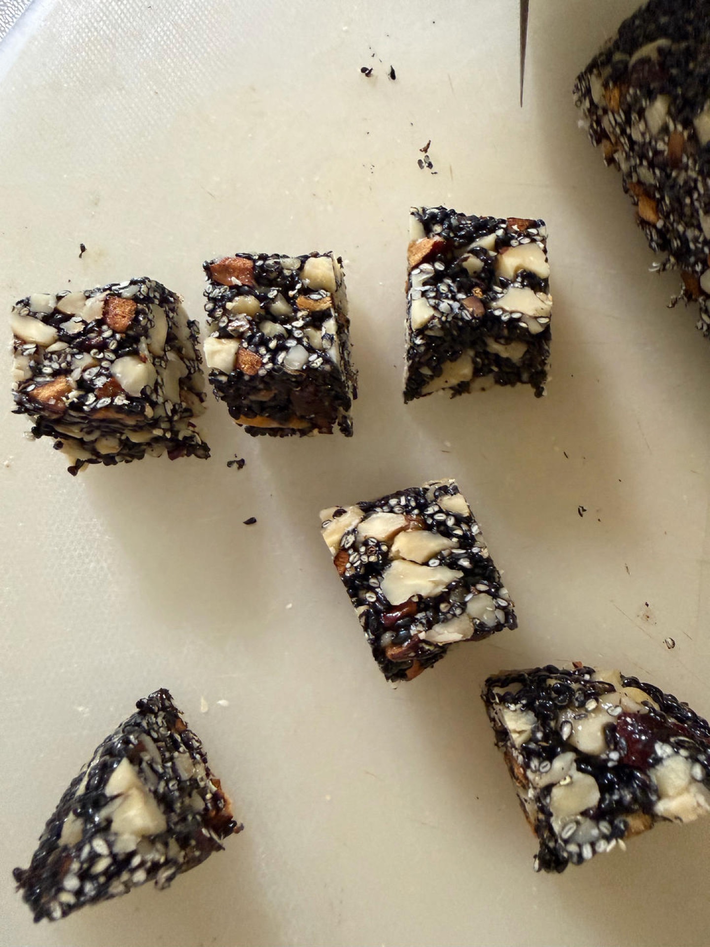 Sesame date slab cut into small squares