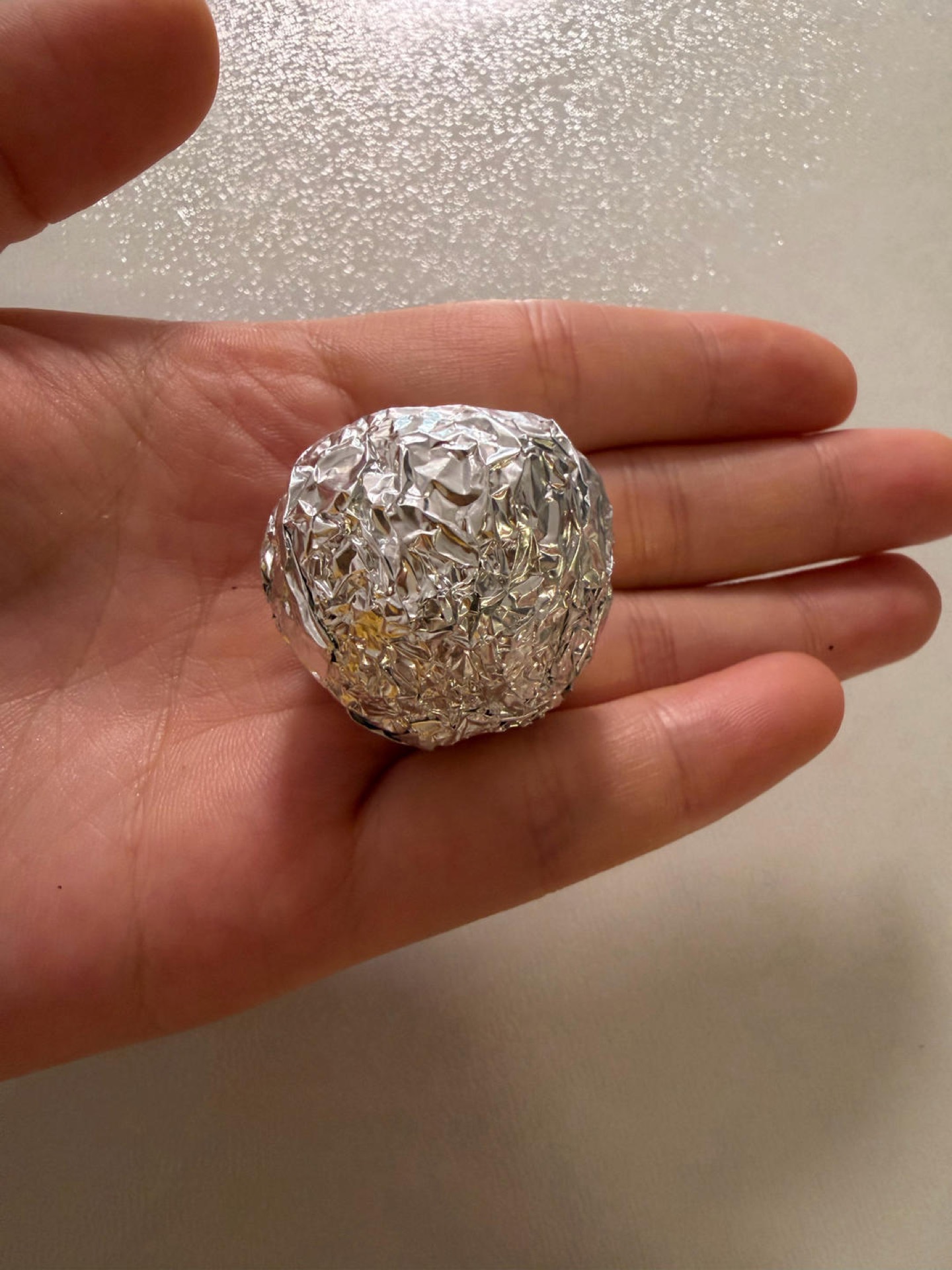 Red date walnut black sesame balls wrapped in foil