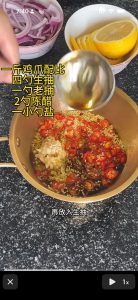 Add four tablespoons of light soy sauce, one tablespoon of dark soy sauce, two tablespoons of aged black vinegar and one teaspoon of salt, then squeeze in the juice of half a lemon
