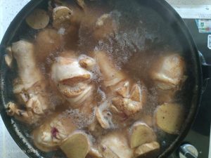 Chicken wings fully submerged in cola