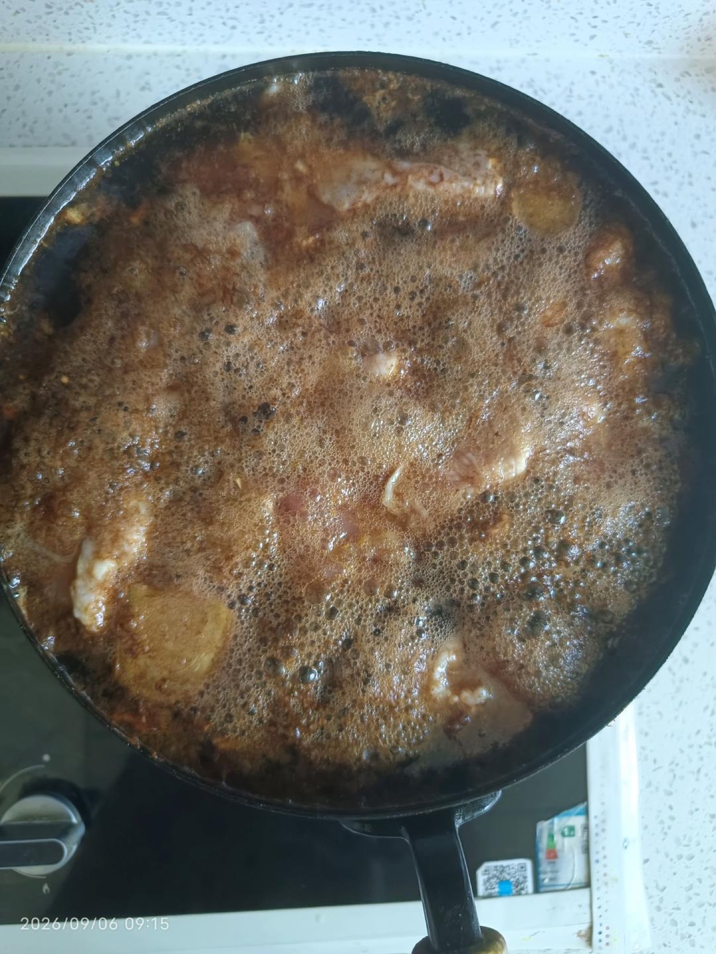Cola chicken wings coming to a boil