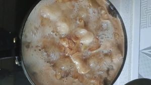 Sauce simmering gently after skimming