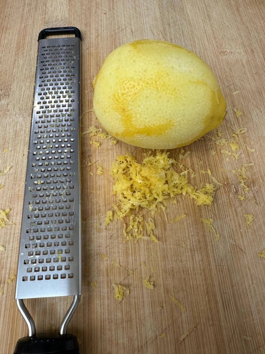 Adding the lemon zest to the cookie dough