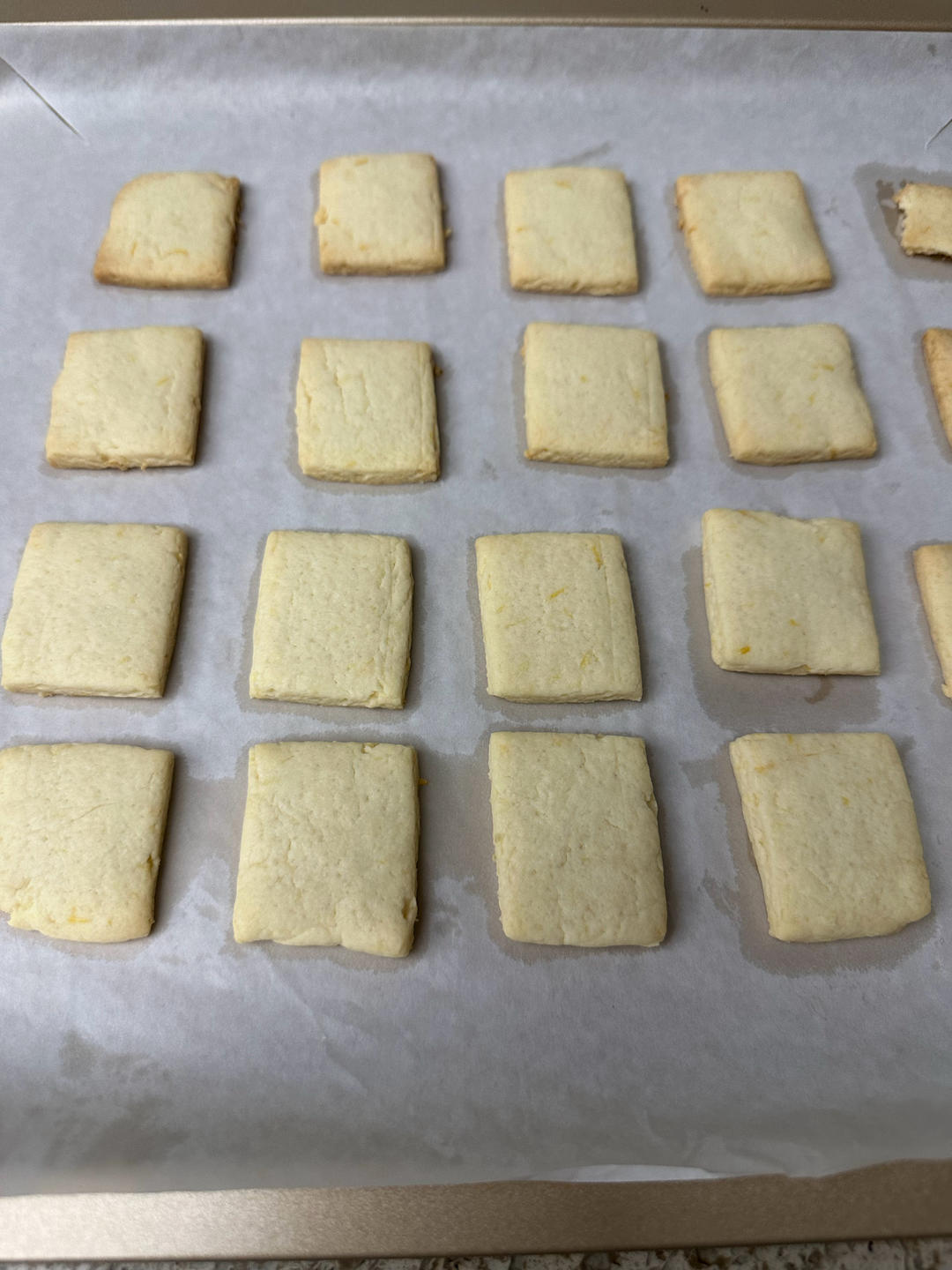 Cooling the baked lemon cookies on the sheet