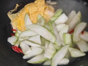 Add the luffa and simmer until it turns soft and translucent.