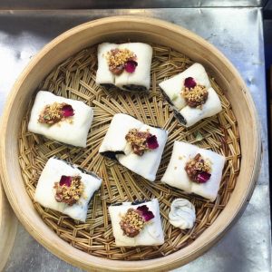 Roll the dough up, cut it into your preferred sizes, and sprinkle the tops with rose and osmanthus.