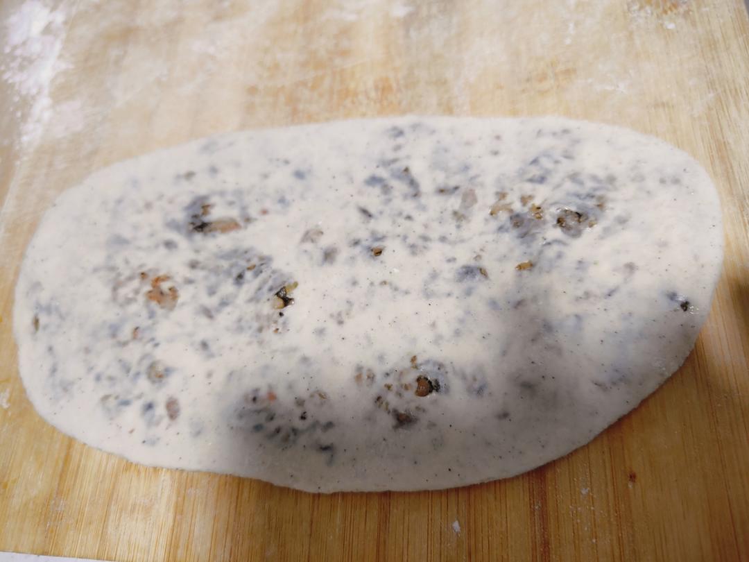 Dough pieces being wrapped around the filling and rolled