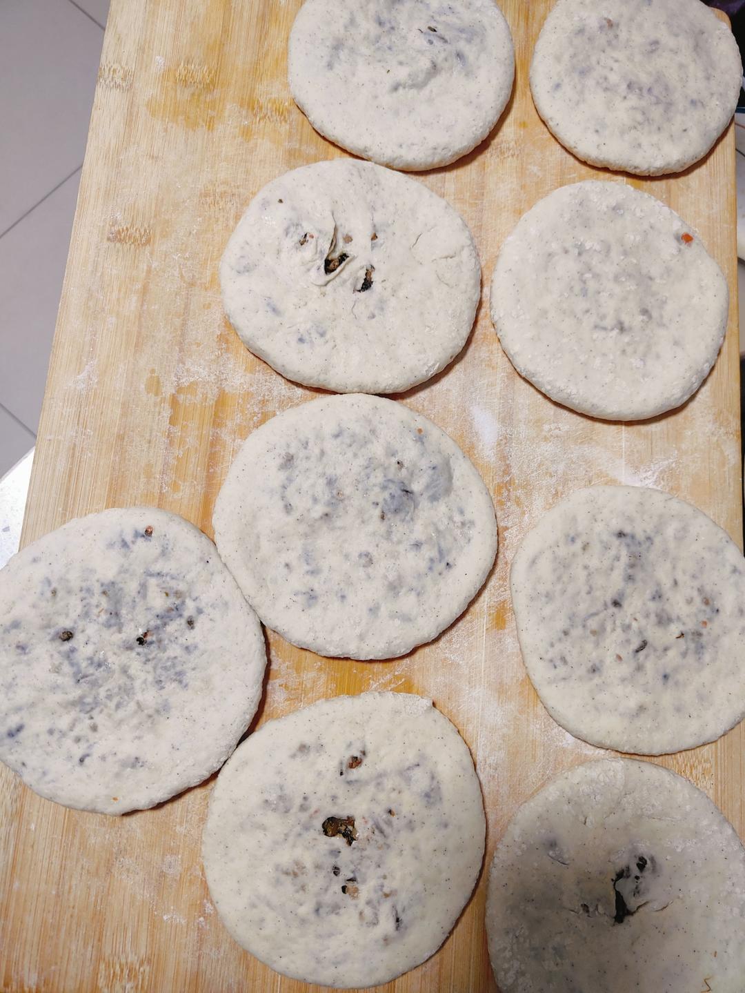 Shaped mei cai pancakes, some long and some round