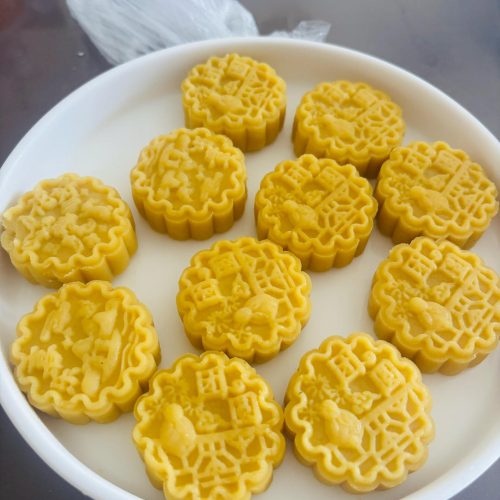 Pale green mung bean cakes pressed into neat rounds