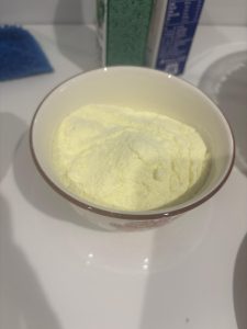 Milk powder measured into a bowl