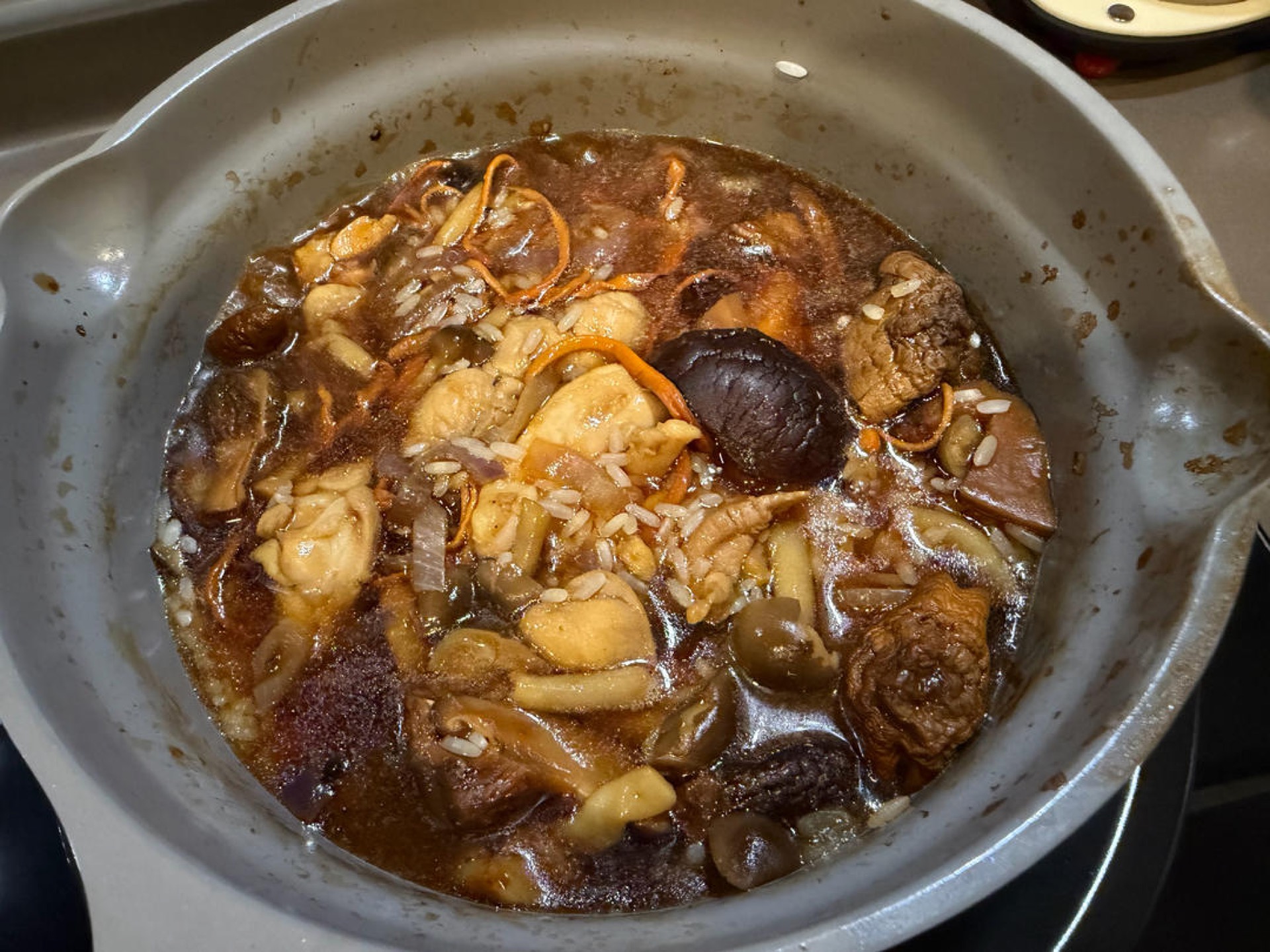 Pour in the water, using the mushroom soaking liquid if you have it, just until it covers the ingredients.