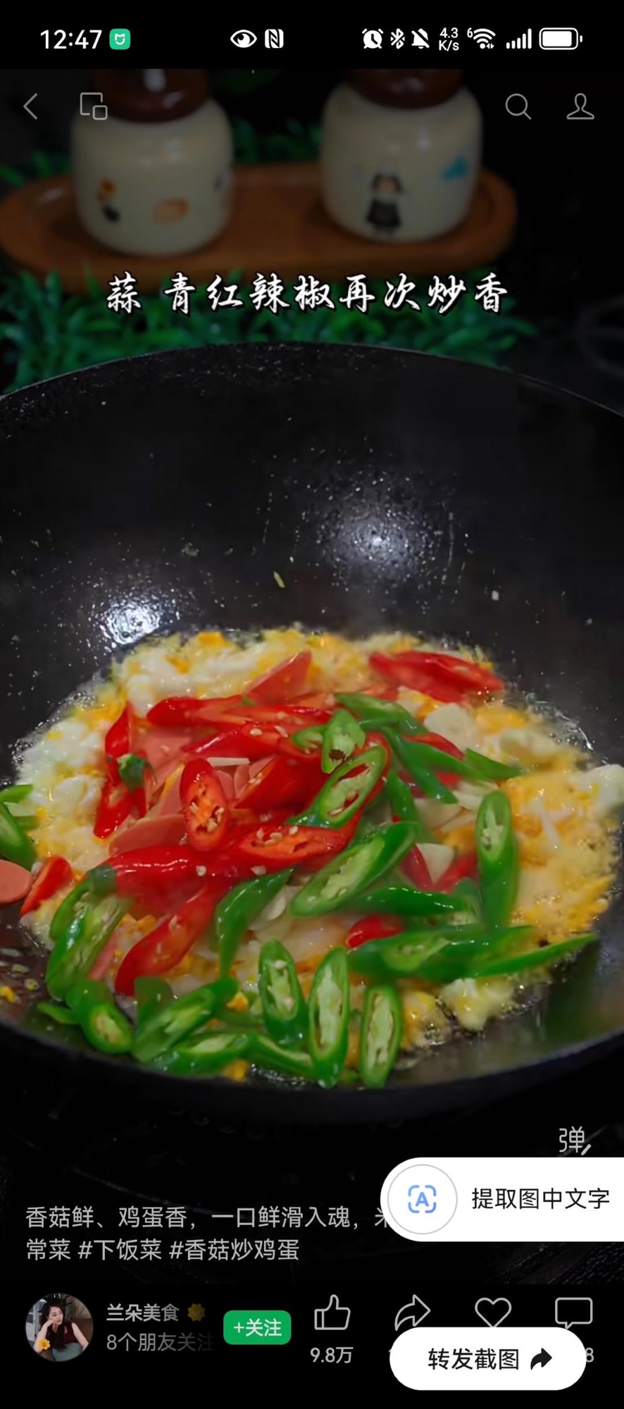 Adding garlic and peppers to the scrambled eggs