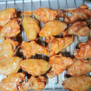 Remove the rack from the oven, brush the wings with a layer of honey water, return them to the oven, and roast for another 20 to 30 minutes, checking the color every 10 minutes wit