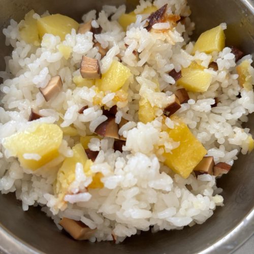 Old-style rice cooker potato rice in an open pot showing golden potato chunks, diced smoked tofu, and fluffy jasmine rice