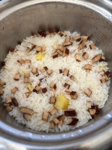Take off the lid, fluff the rice and potatoes together, and serve.