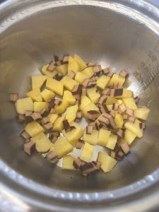 Cut the smoked tofu into small dice and scatter them over the potato chunks.