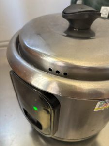 On an old-style rice cooker, keep cooking until the switch pops from cook to warm.