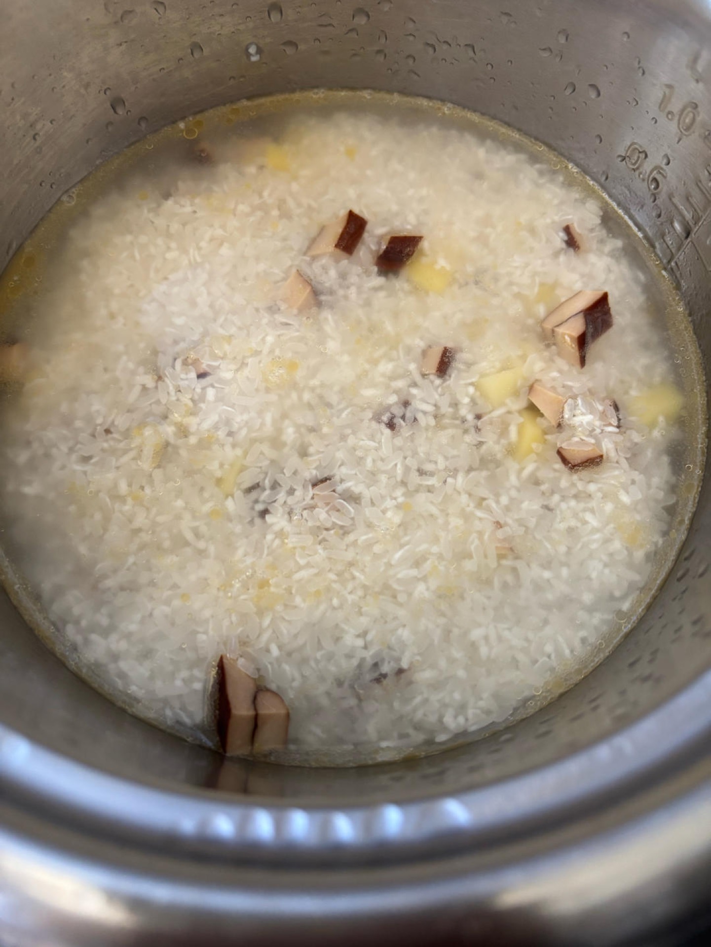 Pour in the water until it sits about half an inch above all the ingredients in the pot.
