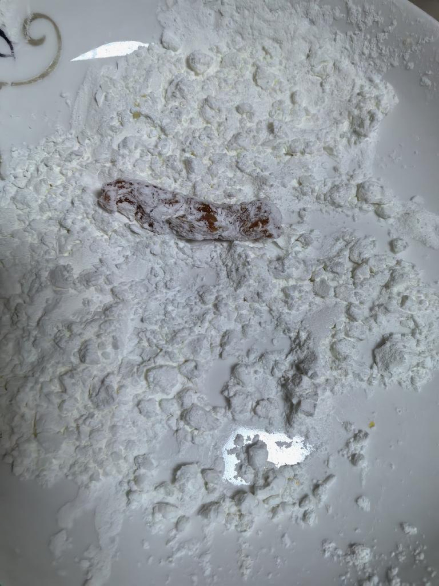 Coat each marinated strip in cornstarch.