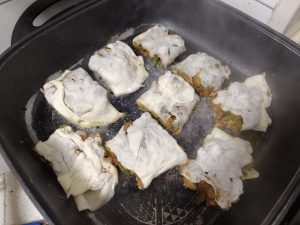 Once the bottom has set, add clean water, just enough to cover about one third of the pieces, cover with a lid and cook for 5 minutes.