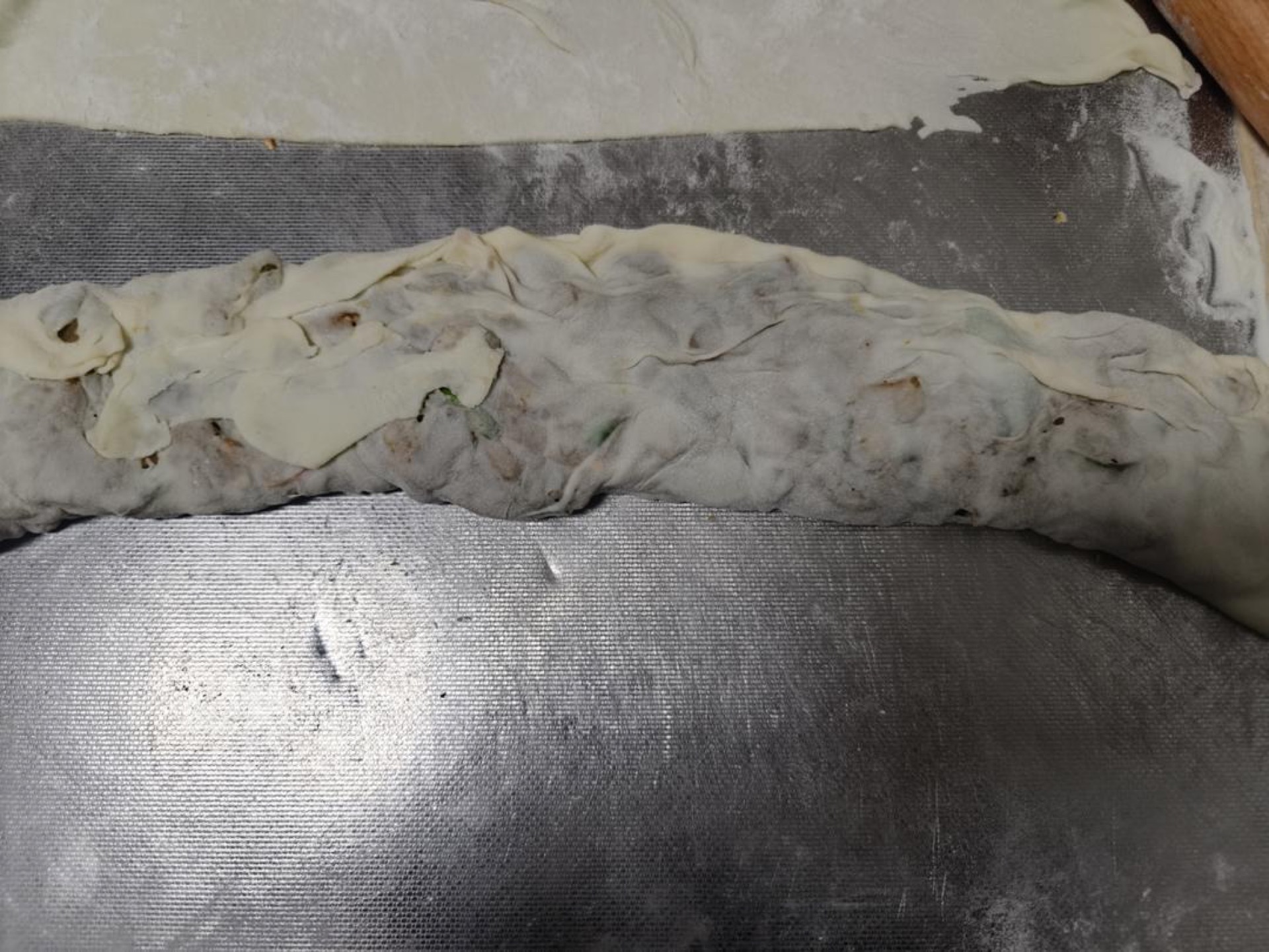 Then fold the half without filling over, and pinch the edges tightly closed.