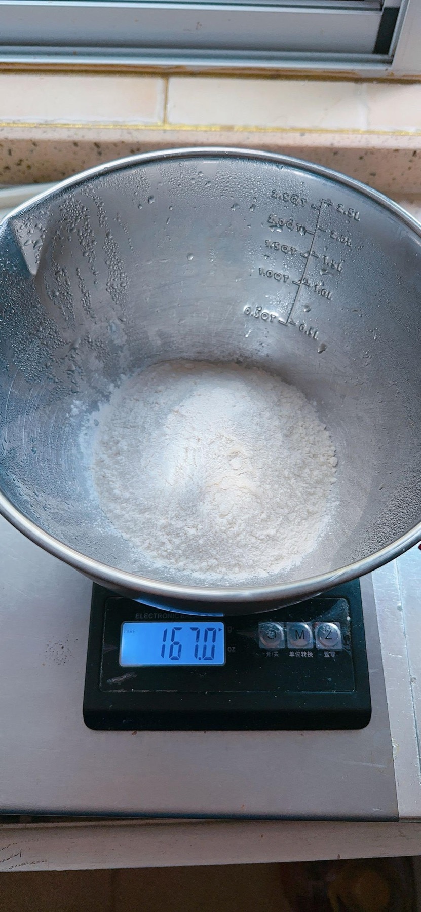Flour weighed into a mixing bowl