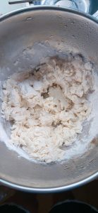 Water being added gradually to the flour