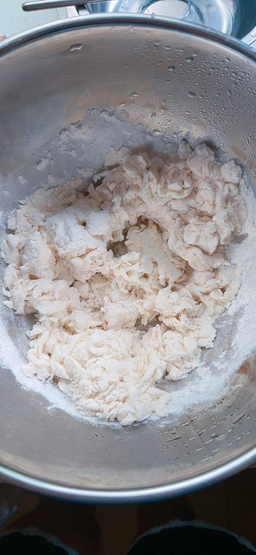 Water being added gradually to the flour