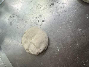 Coiled dough resting on the work surface
