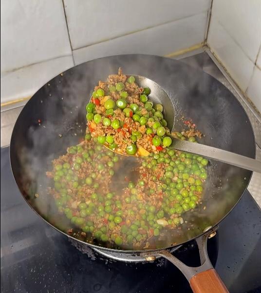 Finished peas and minced pork served over rice