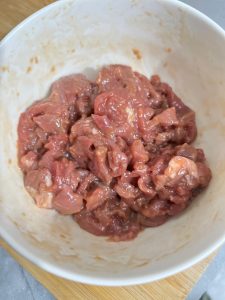 Mix everything with your hands until the beef is evenly coated and sticky, then let it marinate for 10 minutes.
