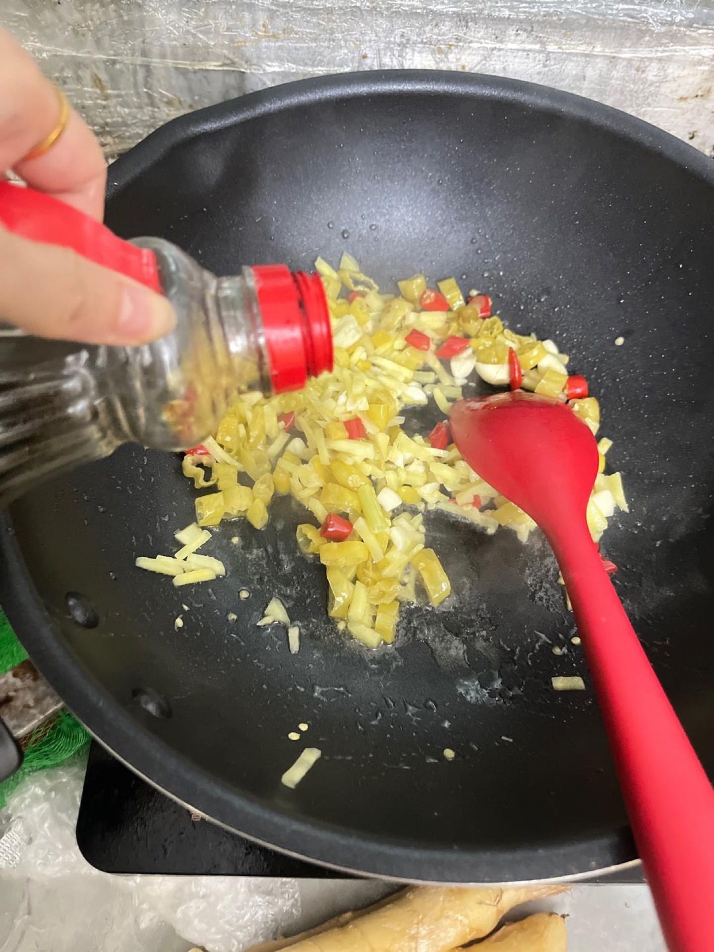 Splash in a little light soy sauce and stir to combine so the aromatics pick up color and salt.
