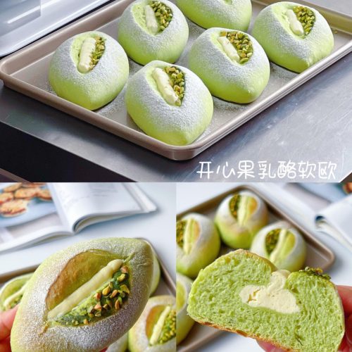 Pistachio cream cheese soft euro bread sliced open to show the green crumb and cream cheese filling